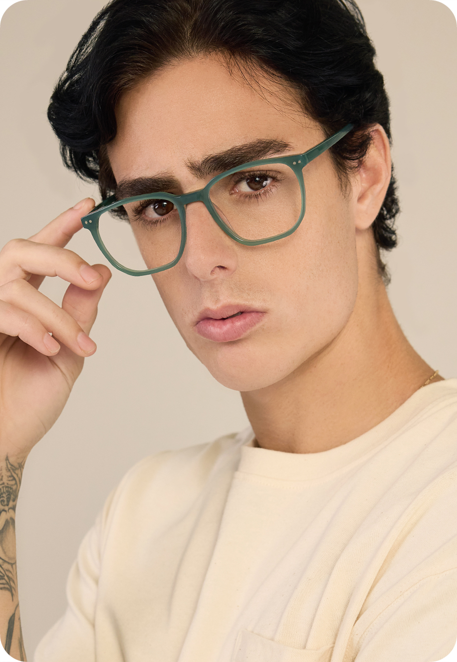 A man wearing Parker Large optical glasses in the colour Jade.