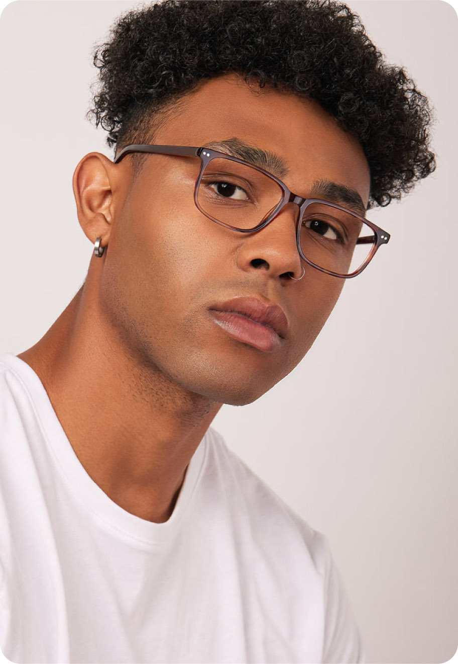 A model wearing Andrew optical glasses in Fox Tortoise.