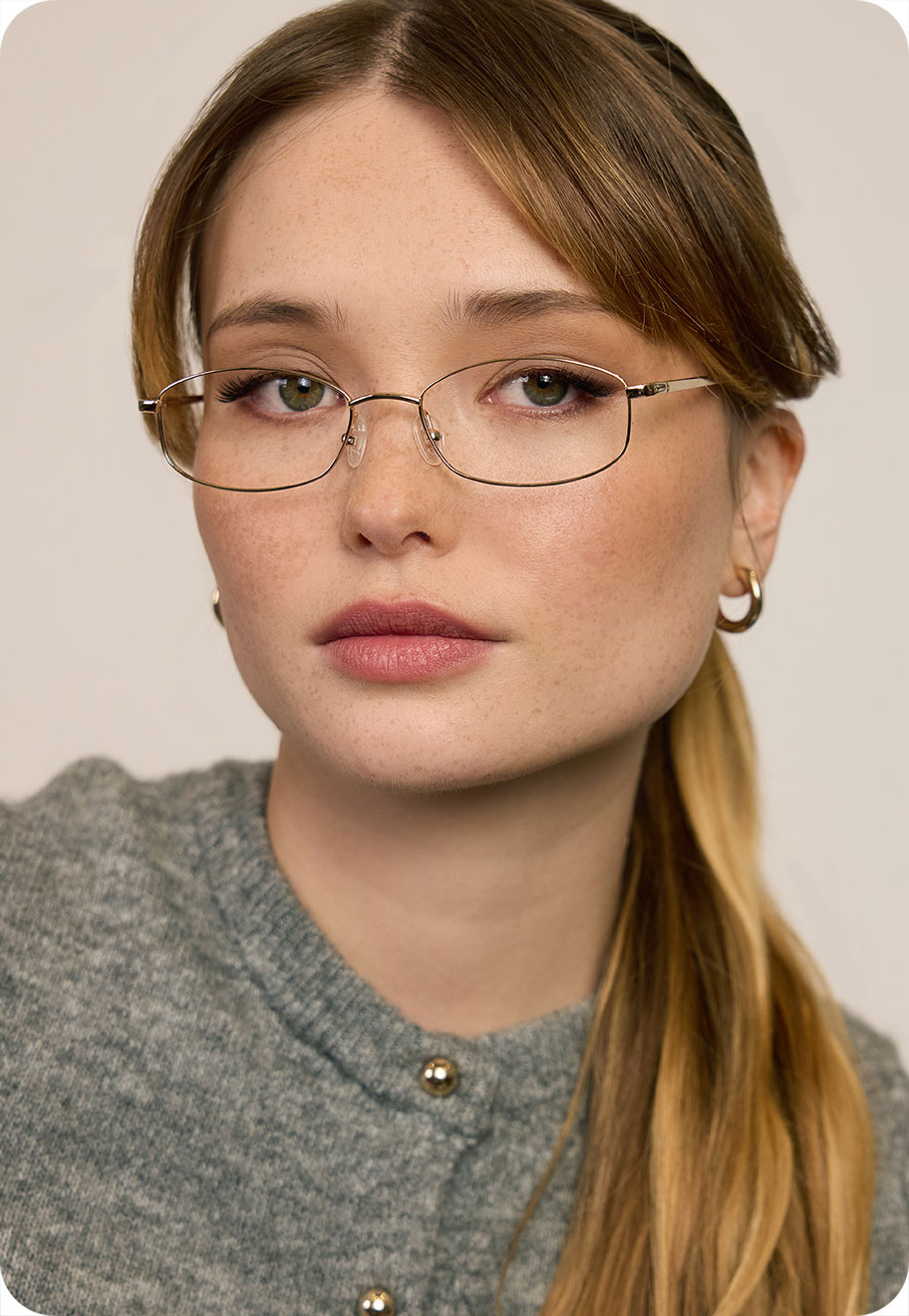 A model wearing Aerin optical glasses.