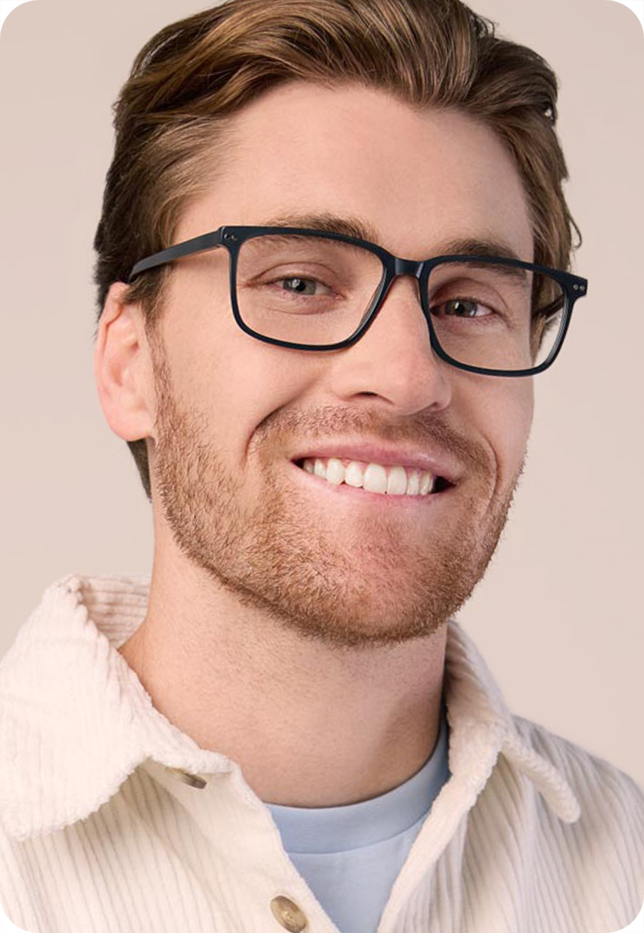 A model wearing Andrew optical glasses in Bluestone.