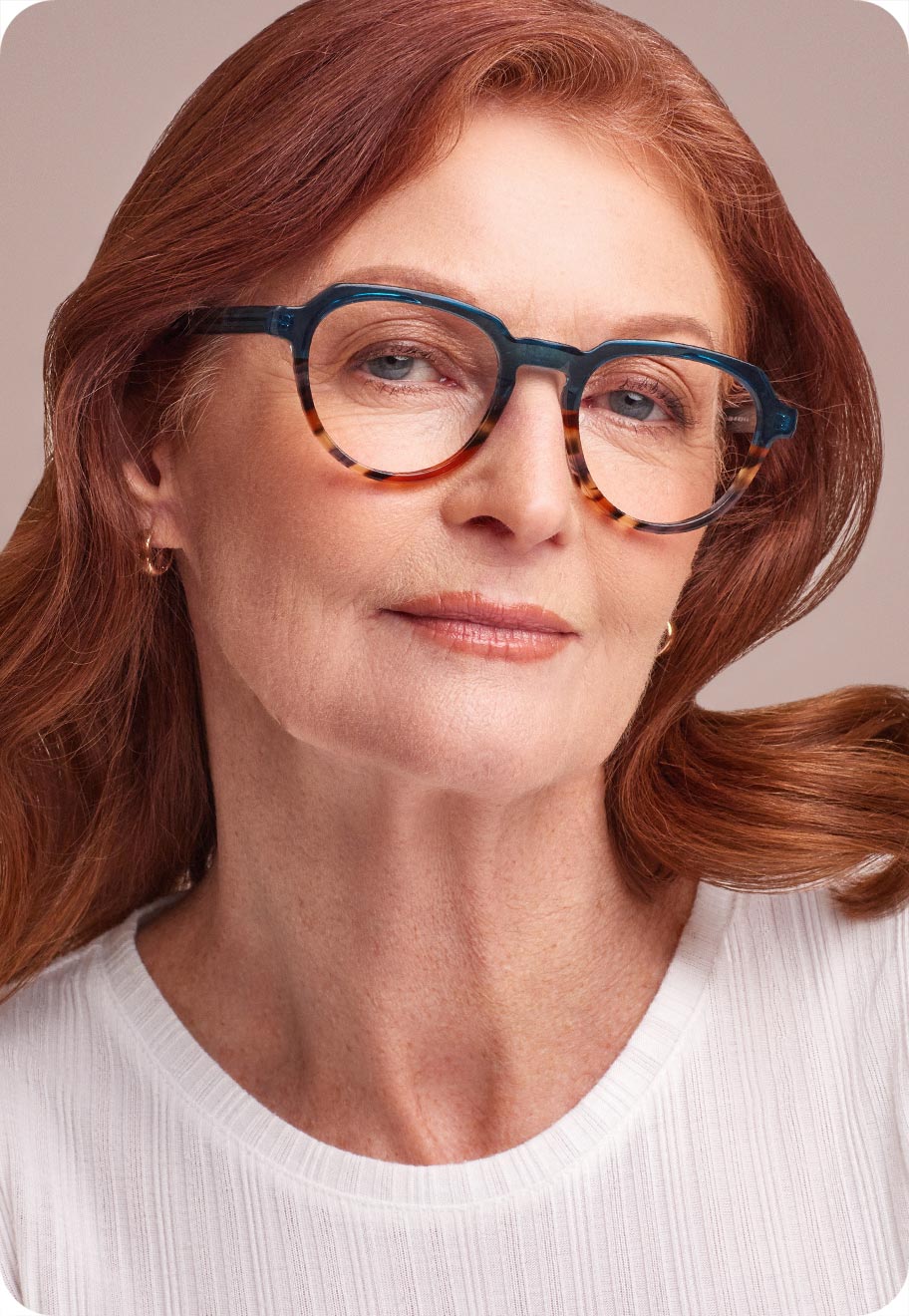 A second photo of a senior woman wearing optical glasses.