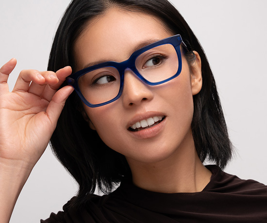 Model wearing Oscar Wylee Serge optical frame in Bright Cobalt.