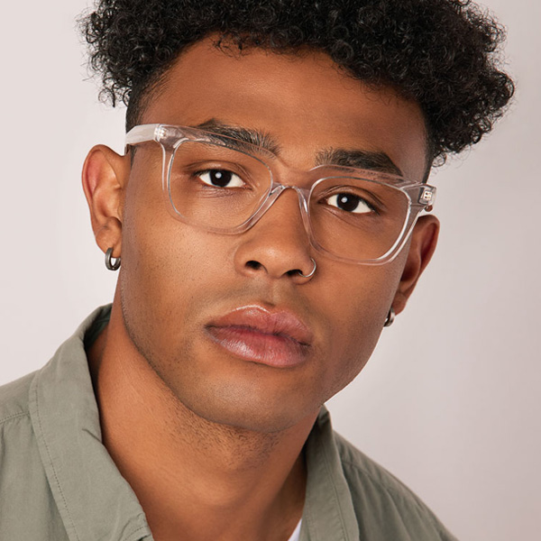Model wearing Serge optical frame in Clear Crystal.