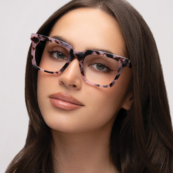 Model wearing Serge optical frame in Opal Tortoise.
