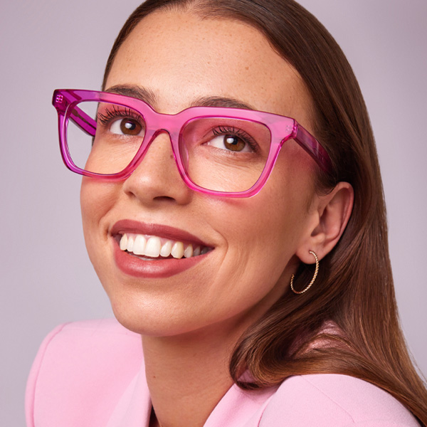 Model wearing Serge optical frame in Electric Pink.