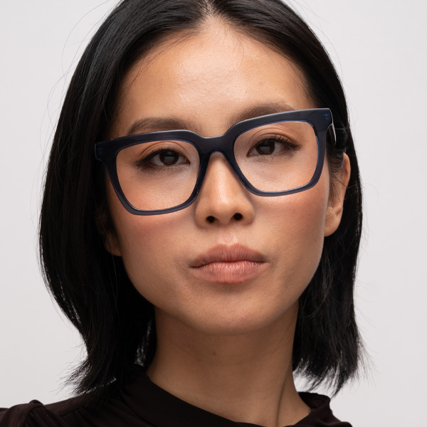 Model wearing Serge optical frame in Surf Blue.