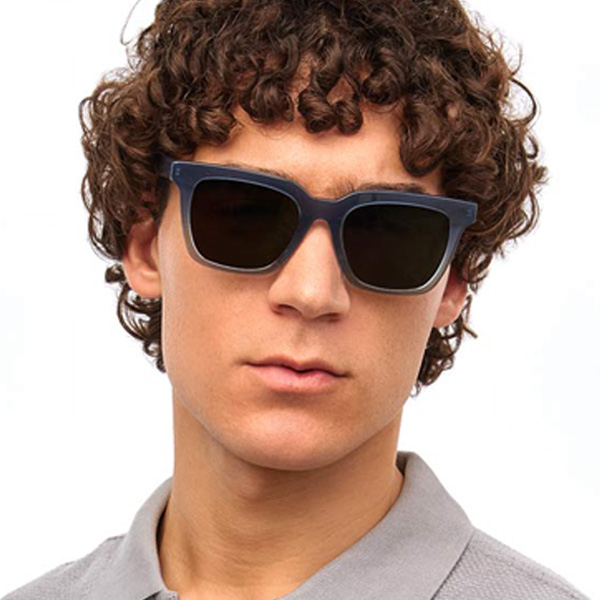 Model wearing Serge sunglasses frame in Denim Fade.