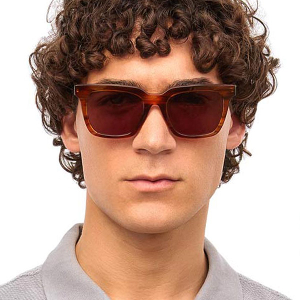 Model wearing Serge sunglasses frame in Smokey Amber.