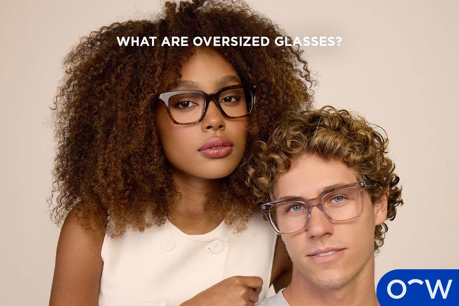 Two people wearing oversized prescription glasses