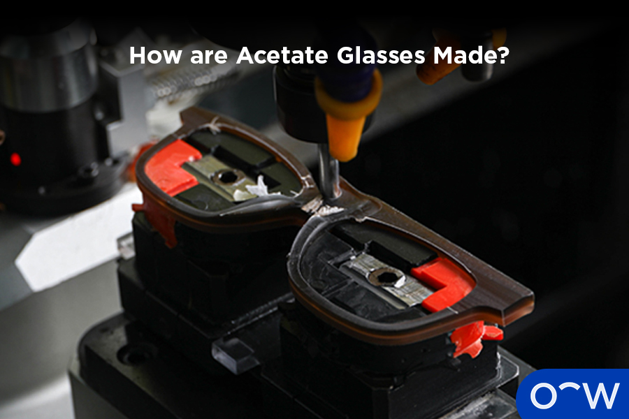 Acetate glasses frame being cut by a machine.