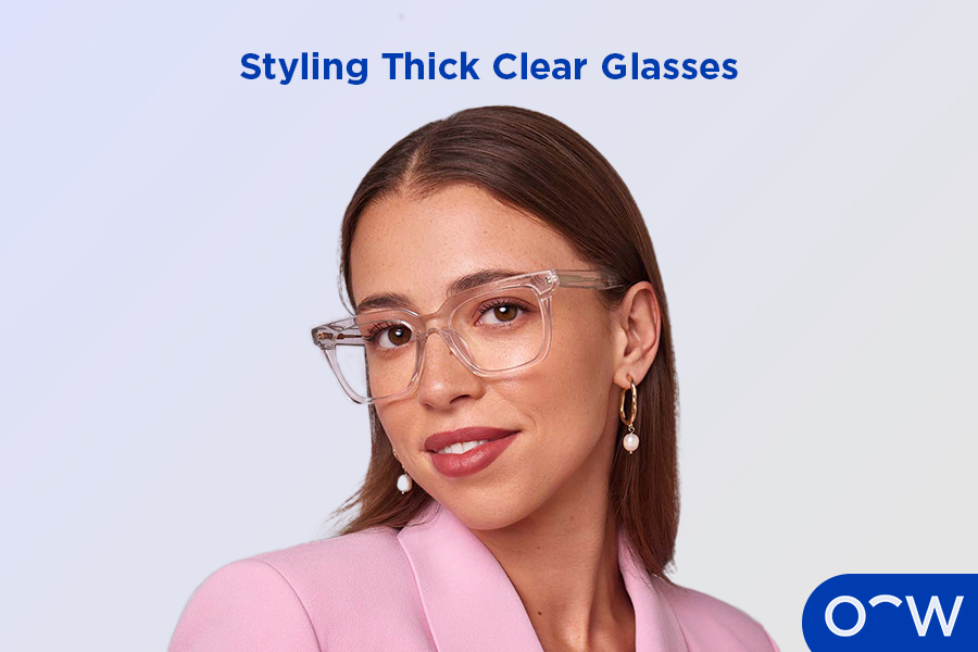 A woman wearing thick clear glasses