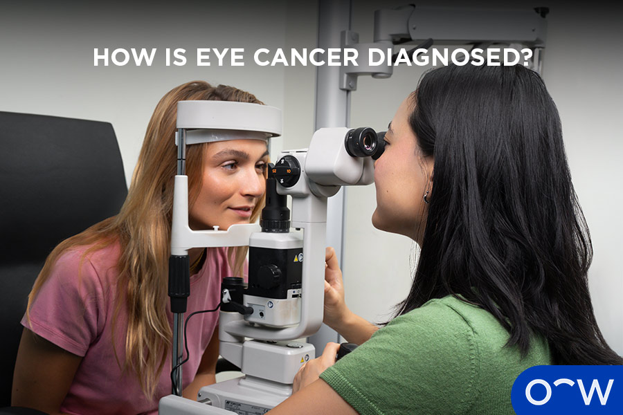 A patient getting her eyes checked with an autorefractor