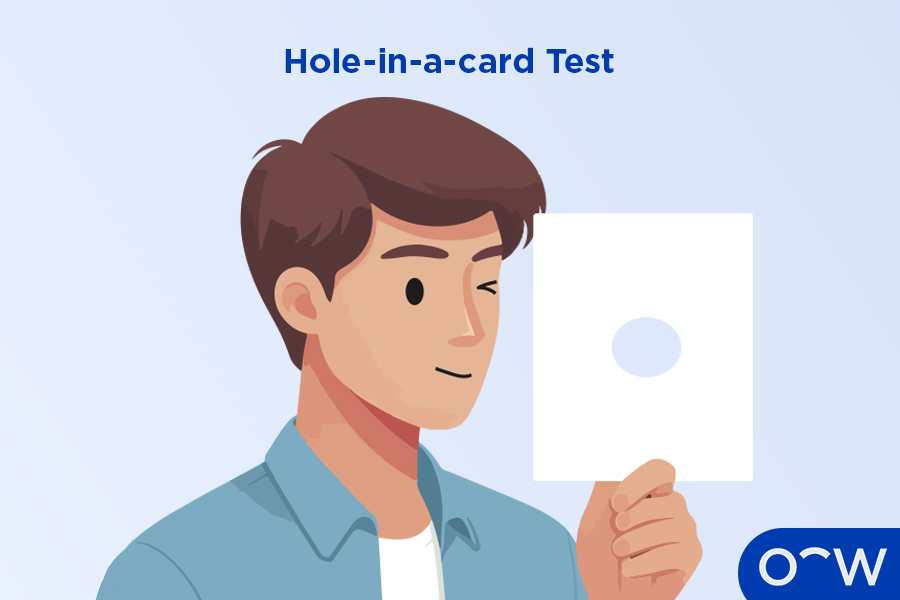 A person doing a hole-in-a-card test, to determine which eye is
dominant.