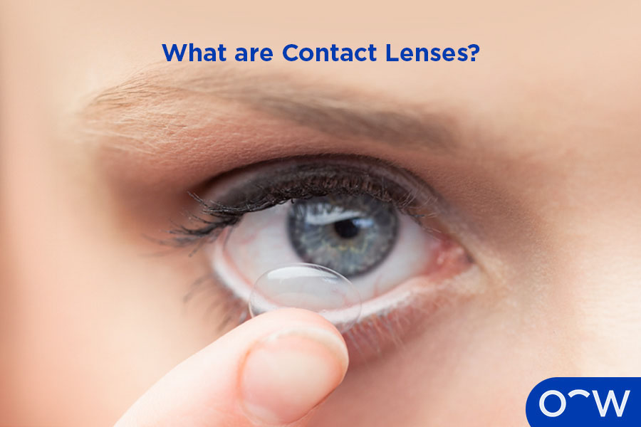 A person putting contact lenses in.