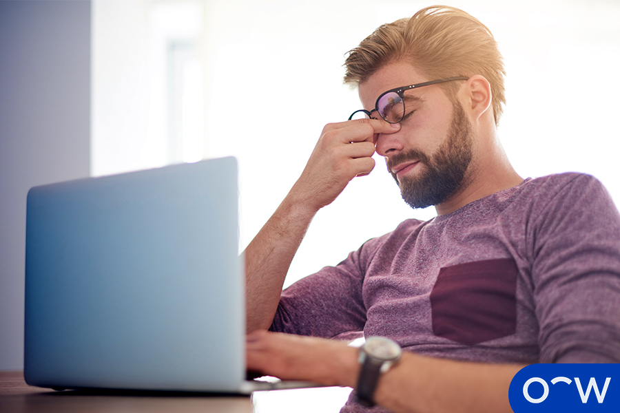 A person with eye strain caused by working on a computer