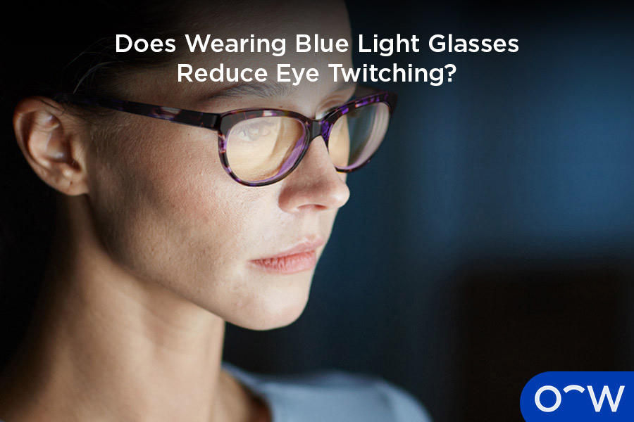Woman wearing blue light glasses looking at a screen