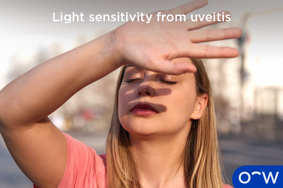 Girl holding up hand to block sun from irritating eyes