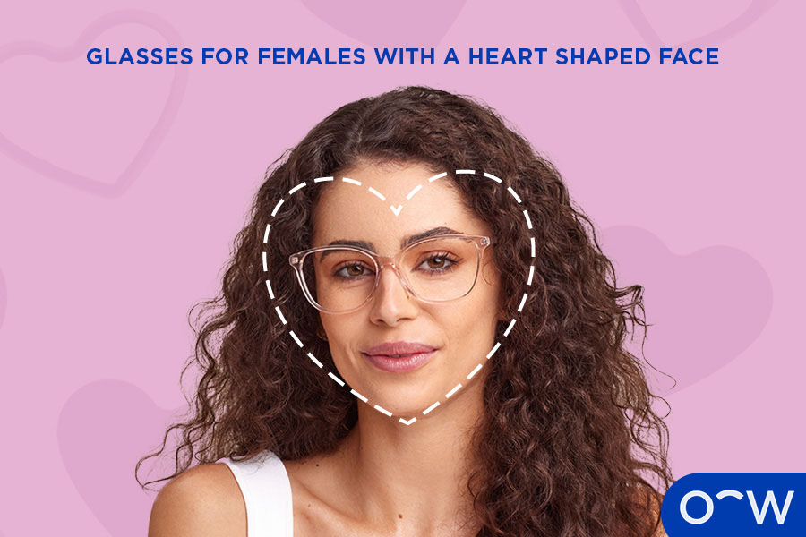 A female with a heart shaped face wearing complementary glasses.