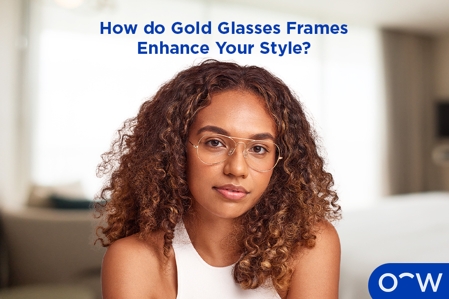 An image of a woman with her head facing down to the side, wearing a pair of gold glasses.
