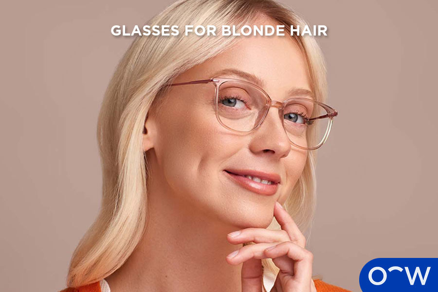 A woman with blonde hair wearing glasses