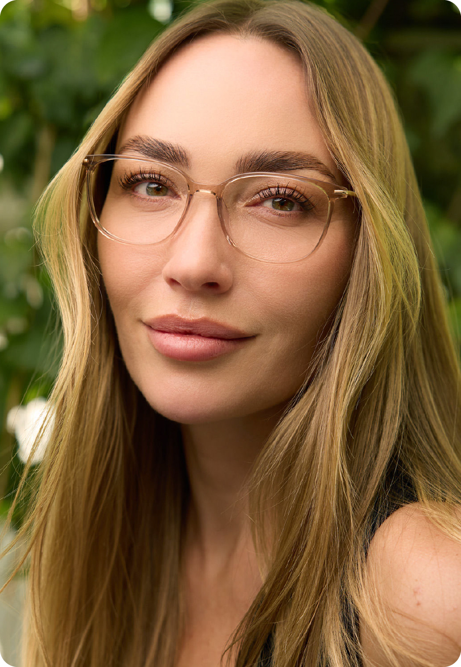 A woman wearing Mumford optical glasses in the colour Bare.