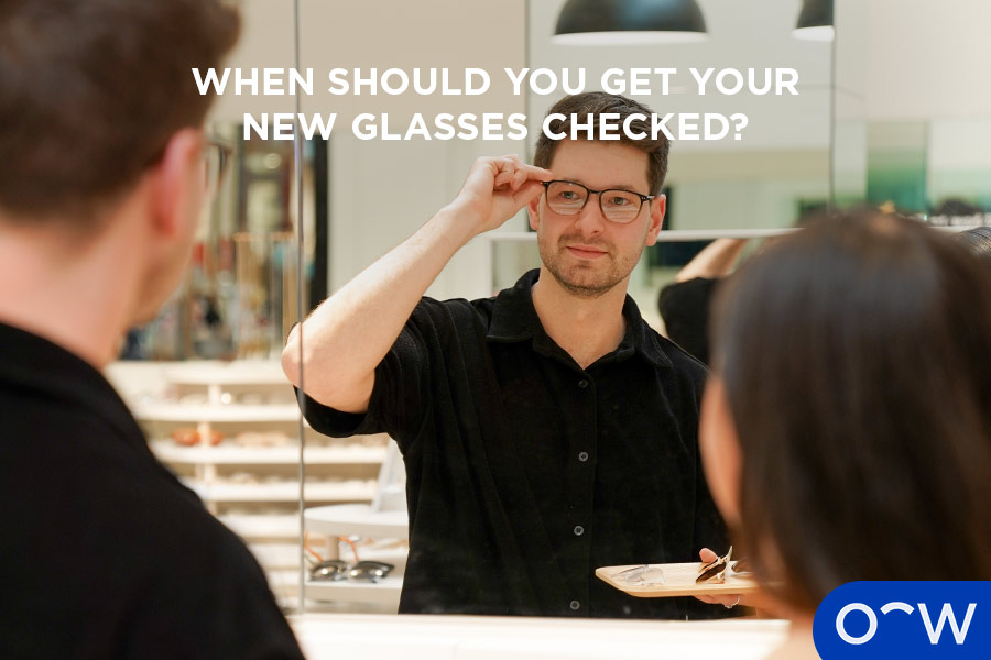 Image of optometrist checking a patient's glasses