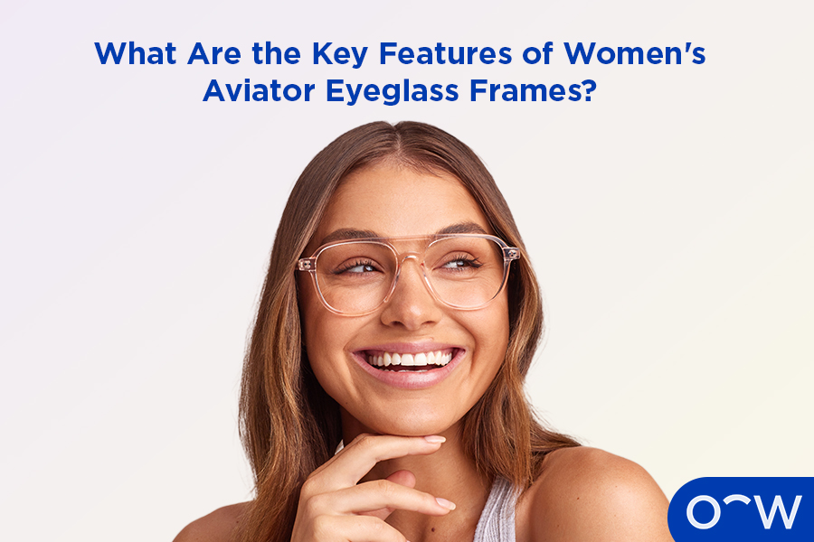 A photo of a woman smiling wearing aviator glasses.