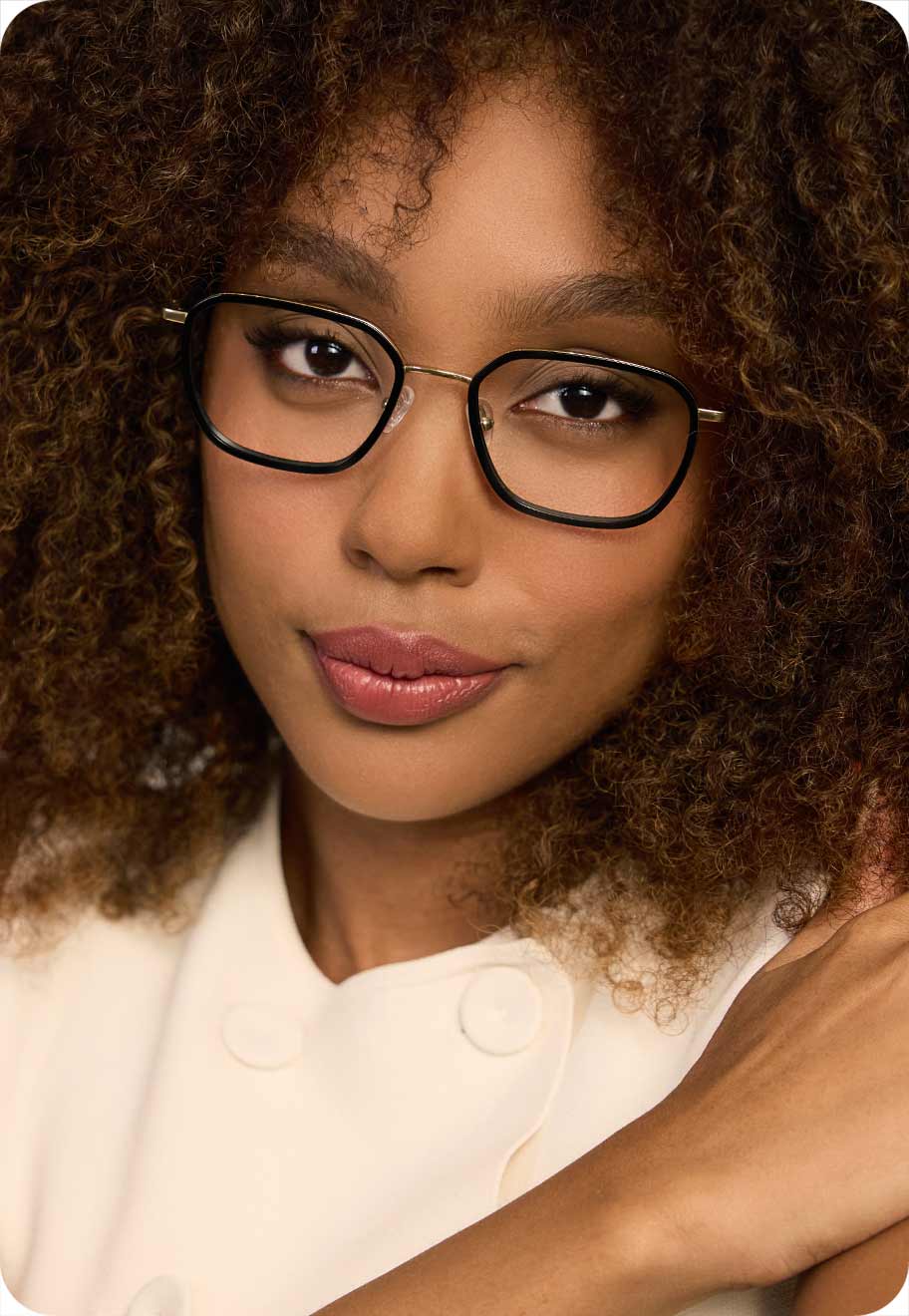 A photo of a model wearing the Oscar Wylee Reece frame in Titanium and Acetate.