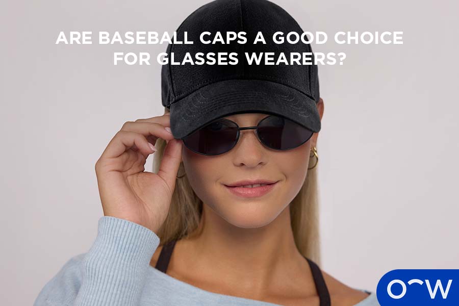 A model wearing a baseball style cap and glasses