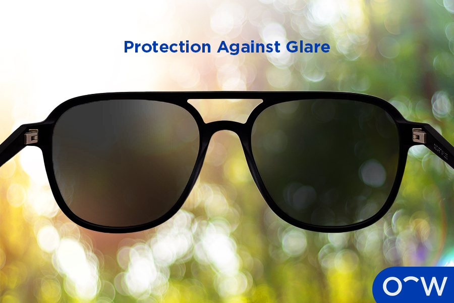 Sunglasses held against an excessively bright horizon indicating the presence of glare.