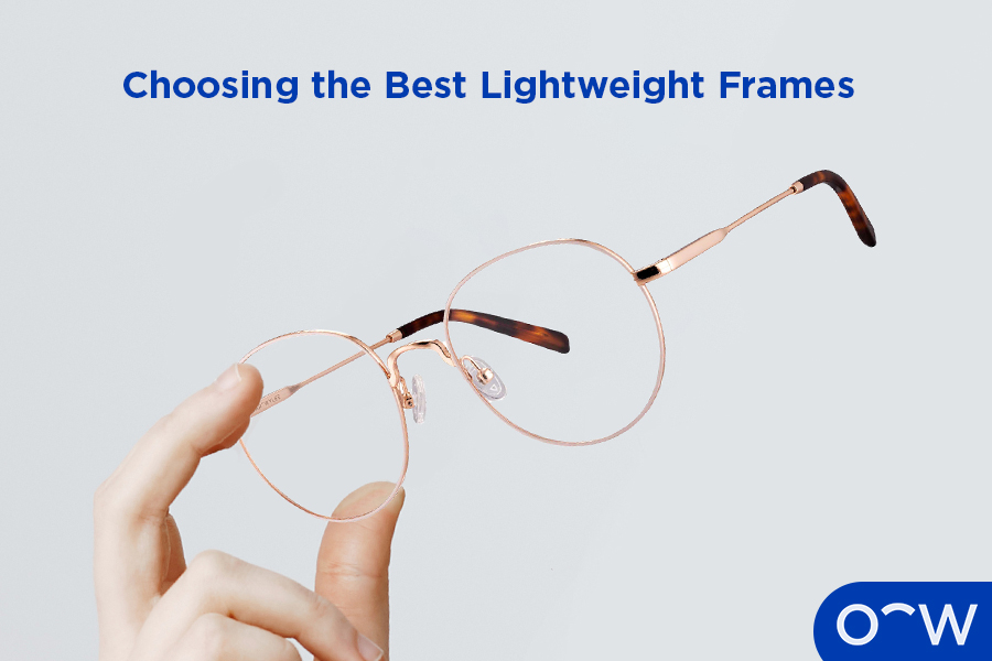 Hands holding a pair of glasses