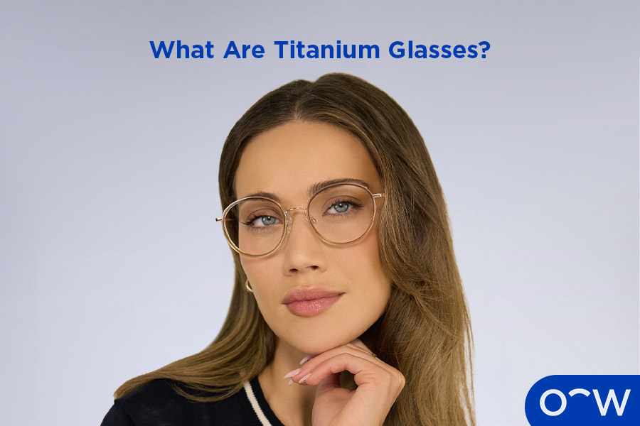 An image of a man posing slightly to the right wearing square round titanium glasses.