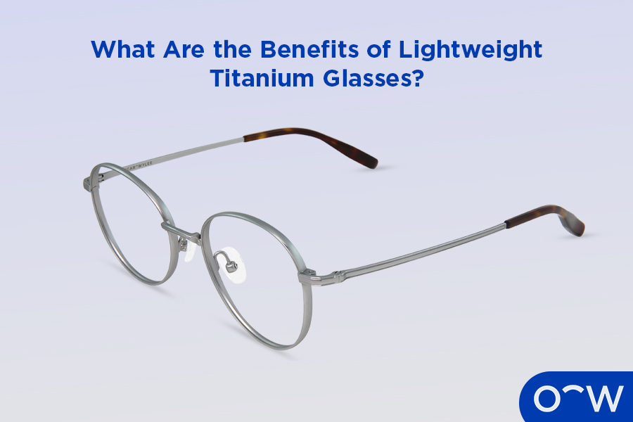 An image of round titanium glasses on a purple background.