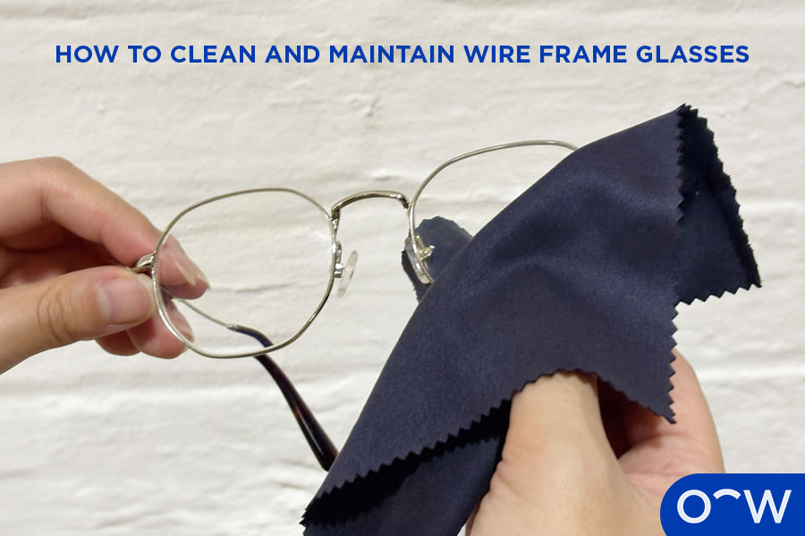 A person cleaning wire frames.