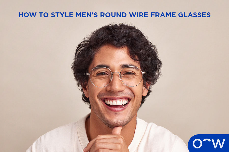 A man wearing round, Oscar Wylee wire frames.