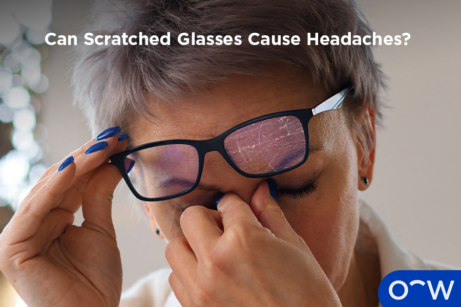 A person with a headache as a result of wearing and using scratched glasses.