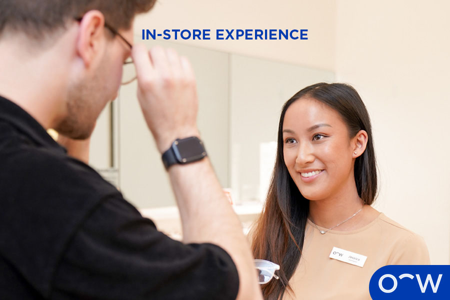 Oscar Wylee optometrist interacting with a customer in-store