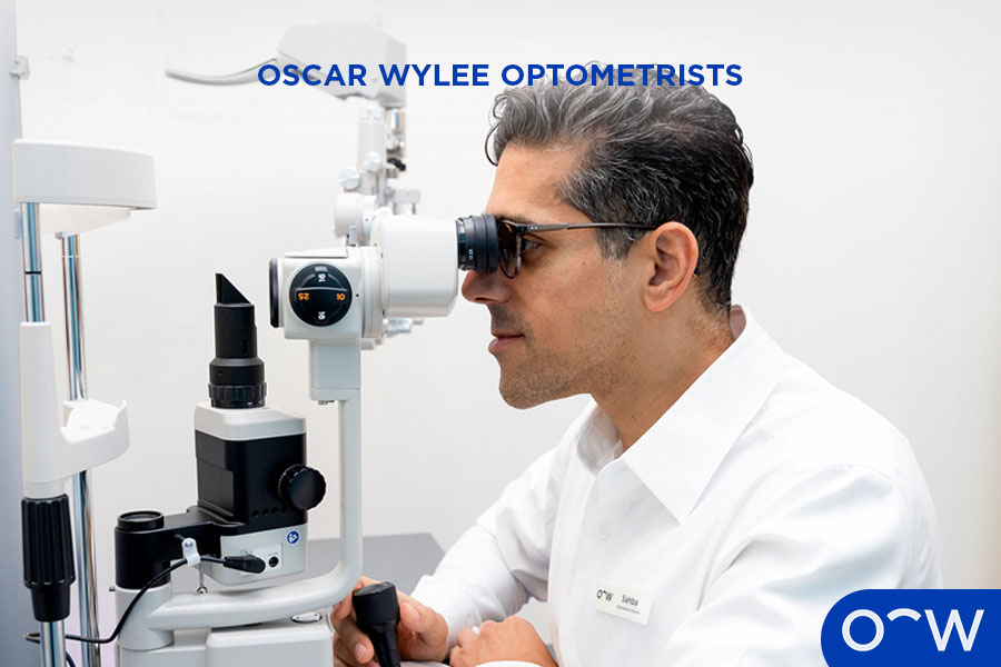 An optometrist conducting a tonometry test on a customer